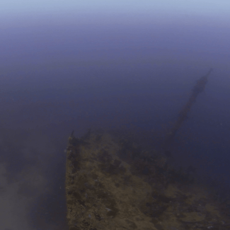 Ghostly Shipwreck Bow: Underwater Ascent