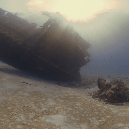 Sunken Ship: Dawn's Light on Ocean Floor