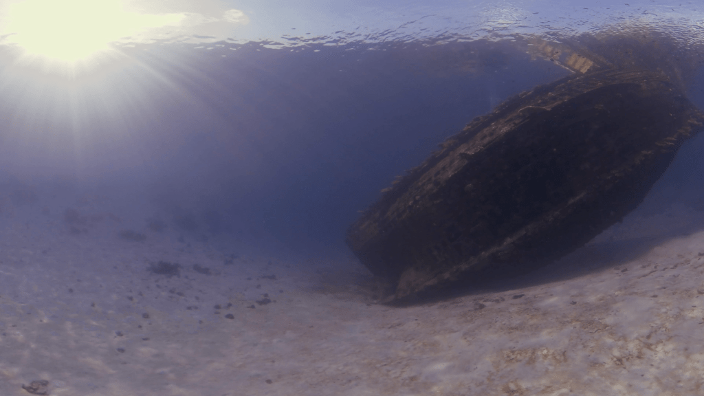 Sunken Ship's Glow: Underwater Serenity